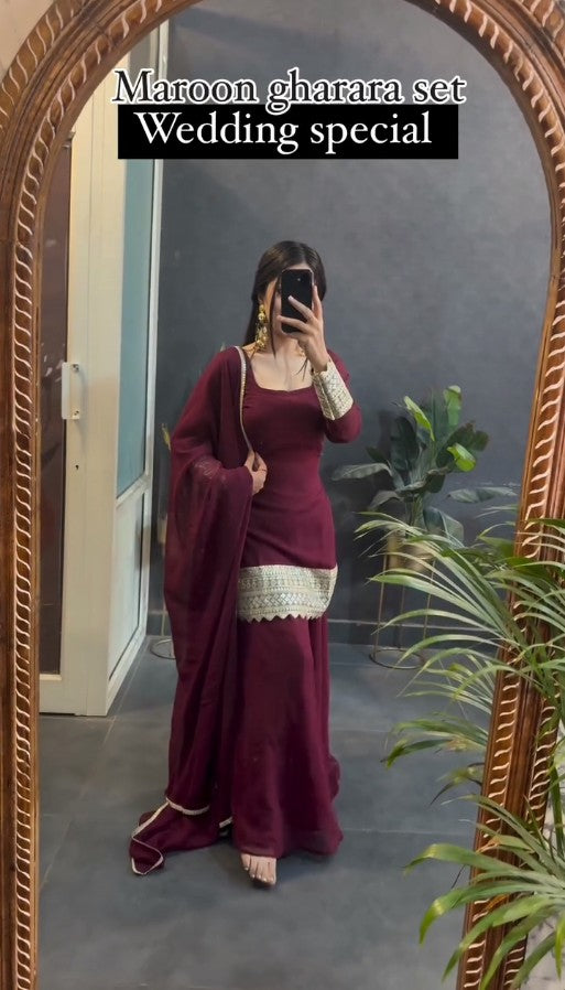 Kaira's Off Maroon Designer Readymade Gown Suit Set .