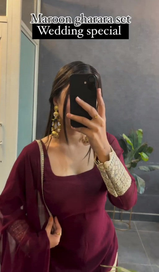 Kaira's Off Maroon Designer Readymade Gown Suit Set .