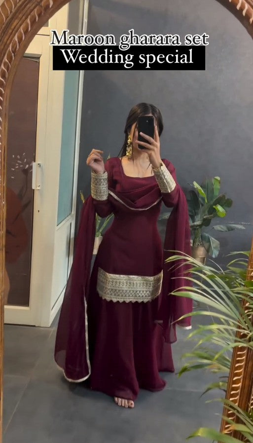 Kaira's Off Maroon Designer Readymade Gown Suit Set .